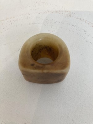 Lot 86 - A GROUP OF THREE CHINESE CARVED JADE ARCHERS RINGS, QING DYNASTY