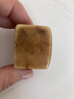 Lot 86 - A GROUP OF THREE CHINESE CARVED JADE ARCHERS RINGS, QING DYNASTY