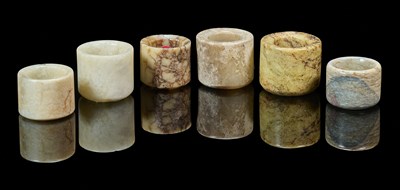 Lot 74 - A GROUP OF SIX CHINESE JADE ARCHERS RINGS, QING DYNASTY, 19TH CENTURY