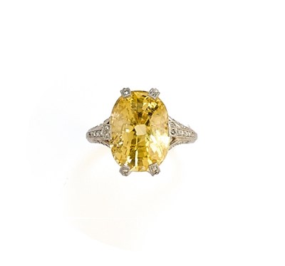Lot 364 - YELLOW SAPPHIRE AND DIAMOND RING