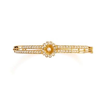Lot 343 - GOLD, HALF-PEARL AND DIAMOND BANGLE, 1890s