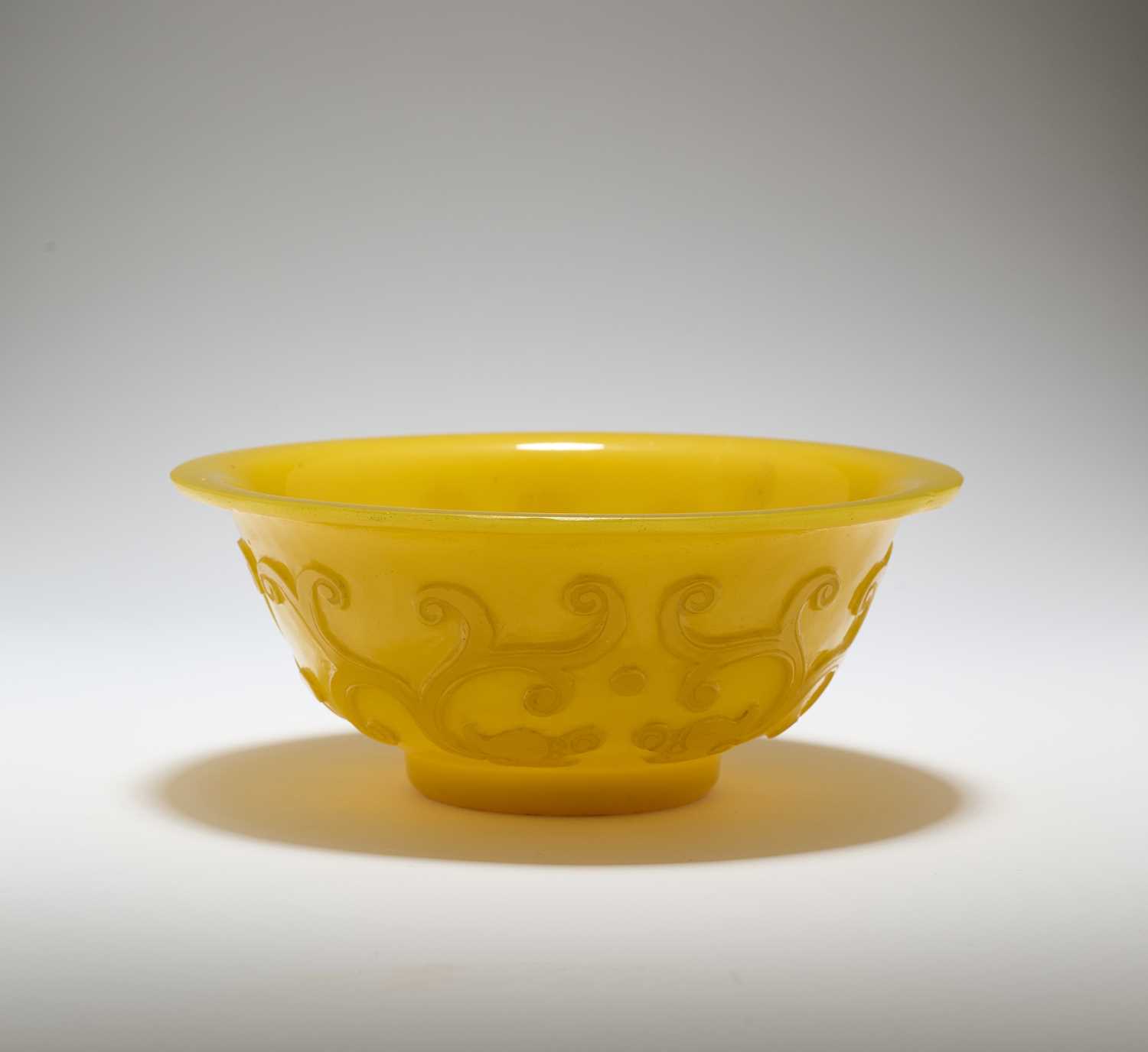 Lot 92 - A CHINESE EGG-YOLK YELLOW GLASS 'DRAGON' BOWL, QING DYNASTY, 19TH CENTURY