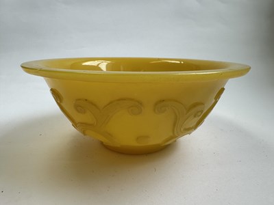 Lot 92 - A CHINESE EGG-YOLK YELLOW GLASS 'DRAGON' BOWL, QING DYNASTY, 19TH CENTURY