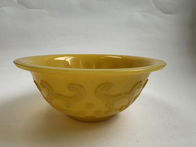 Lot 92 - A CHINESE EGG-YOLK YELLOW GLASS 'DRAGON' BOWL, QING DYNASTY, 19TH CENTURY
