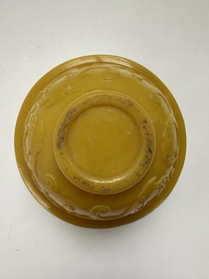 Lot 92 - A CHINESE EGG-YOLK YELLOW GLASS 'DRAGON' BOWL, QING DYNASTY, 19TH CENTURY