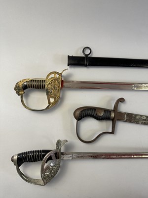 Lot 588 - AN IMPERIAL GERMAN MODEL 1889 KINGS DRAGOON REGT NR. 26 CAVALRY SWORD, A BAVARIAN OFFICER'S SWORD, AND AN IMPERIAL GERMAN CAVALRY SWORD, LATE 19TH CENTURY