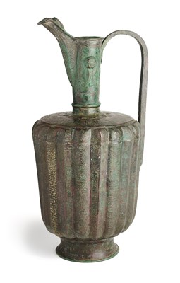 Lot 76 - A KHURASAN BRONZE EWER, EASTERN IRAN OR AFGHANISTAN, CIRCA 13TH CENTURY