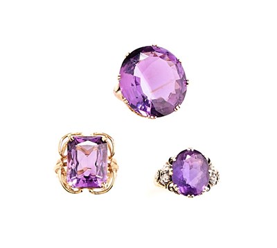 Lot 459 - THREE AMETHYST DRESS RINGS