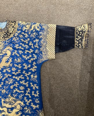 Lot 70 - A CHINESE EMBROIDERED SILK ‘NINE DRAGON’ ROBE, JIFU, LATE QING DYNASTY, CIRCA 1900