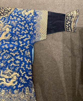 Lot 70 - A CHINESE EMBROIDERED SILK ‘NINE DRAGON’ ROBE, JIFU, LATE QING DYNASTY, CIRCA 1900