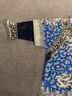 Lot 70 - A CHINESE EMBROIDERED SILK ‘NINE DRAGON’ ROBE, JIFU, LATE QING DYNASTY, CIRCA 1900