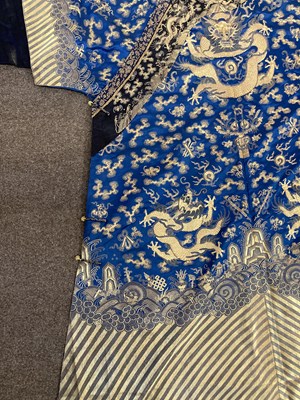 Lot 70 - A CHINESE EMBROIDERED SILK ‘NINE DRAGON’ ROBE, JIFU, LATE QING DYNASTY, CIRCA 1900