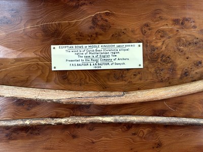 Lot 1 - TWO ANCIENT EGYPTIAN BOWS, PROBABLY MIDDLE KINGDOM CIRCA 2000 B.C., AND THREE STONE ARROWHEADS