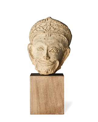 Lot 372 - A HARIPUNJAYA FRAGMENTARY HEAD OF A MALE DEITY, NORTHERN THAILAND, CIRCA 13TH CENTURY