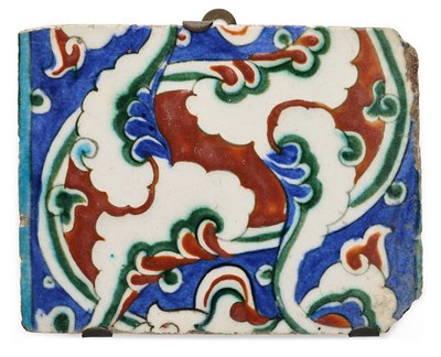 Lot 118 - AN IZNIK BORDER TILE SECTION, OTTOMAN ANATOLIA, CIRCA 1570