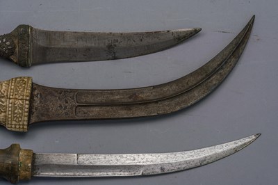 Lot 558 - A PERSIAN DAGGER (JAMBIYA) AND TWO FURTHER DAGGERS (JAMBIYA), LATE 19TH/20TH CENTURY