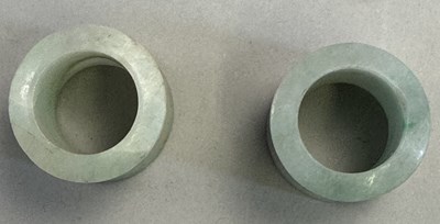 Lot 521 - □ TWO CHINESE JADEITE ARCHERS RINGS, QING DYNASTY, 19TH CENTURY