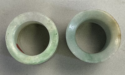 Lot 521 - □ TWO CHINESE JADEITE ARCHERS RINGS, QING DYNASTY, 19TH CENTURY