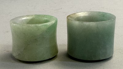 Lot 521 - □ TWO CHINESE JADEITE ARCHERS RINGS, QING DYNASTY, 19TH CENTURY