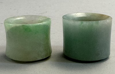 Lot 521 - □ TWO CHINESE JADEITE ARCHERS RINGS, QING DYNASTY, 19TH CENTURY