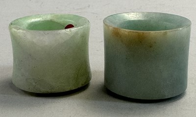 Lot 521 - □ TWO CHINESE JADEITE ARCHERS RINGS, QING DYNASTY, 19TH CENTURY