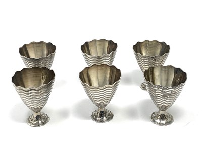 Lot 48 - A SET OF SIX SILVER ZARFS, OTTOMAN EMPIRE OR SUCCESSOR STATES, EARLY 20TH CENTURY