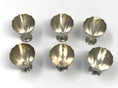 Lot 48 - A SET OF SIX SILVER ZARFS, OTTOMAN EMPIRE OR SUCCESSOR STATES, EARLY 20TH CENTURY