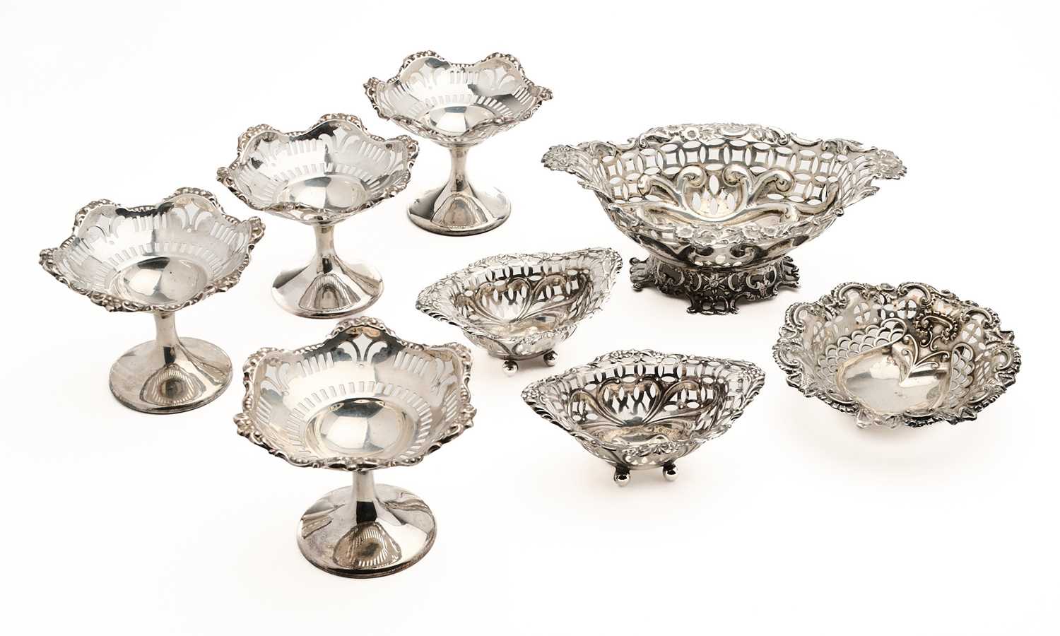 Lot 566 - A GROUP OF EIGHT ASSORTED ENGLISH SILVER SWEETMEAT DISHES, BIRMINGHAM, 1893-1915