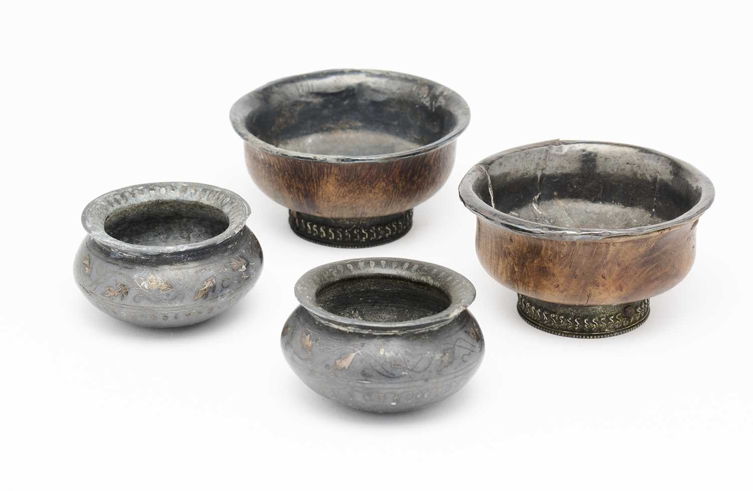 Lot 511 - TWO SHEET SILVER MOUNTED WOOD TEABOWLS, TIBET, CIRCA 1900