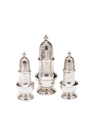 Lot 398 - A SET OF THREE GEORGE II SILVER CASTERS^...