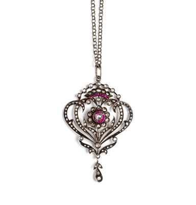 Lot 434 - DIAMOND AND RUBY PENDANT^ 1900s¦of foliate and...