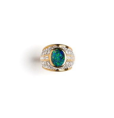 Lot 437 - DIAMOND AND OPAL DRESS RING¦the oval cabochon...