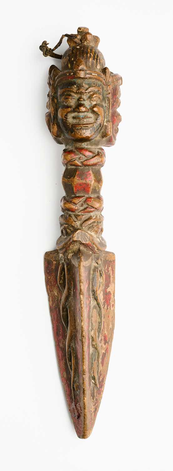 Lot 408 - A CARVED AND PAINTED WOOD RITUAL DAGGER (PHURBU), TIBET, 19TH CENTURY