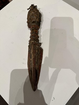 Lot 408 - A CARVED AND PAINTED WOOD RITUAL DAGGER (PHURBU), TIBET, 19TH CENTURY
