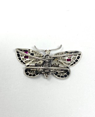 Lot 363 - DIAMOND, ONYX AND RUBY BROOCH, 1920s