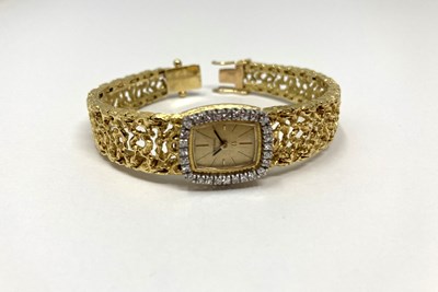 Lot 308 - OMEGA: A LADY'S GOLD AND DIAMOND BRACELET WATCH, SWISS, CIRCA 1966