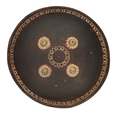 Lot 20 - AN INDIAN HIDE SHIELD (DHAL), 19TH CENTURY, SIGNED BHAGUAN KHOOSALOA, AHMEDABAD