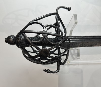 Lot 150 - A RARE NORTH EUROPEAN BASKET-HILTED BACK-SWORD, EARLY 17TH CENTURY, DUTCH OR ENGLISH