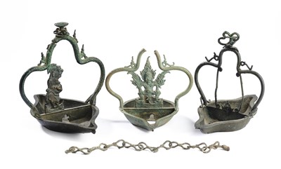 Lot 252 - THREE JAVANESE BRONZE HANGING LAMPS, INDONESIA, CIRCA 14TH CENTURY