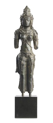 Lot 256 - A FRAGMENTARY JAVANESE BRONZE FIGURE OF PARVATI OR BHU-DEVII, INDONESIA, 9TH CENTURY