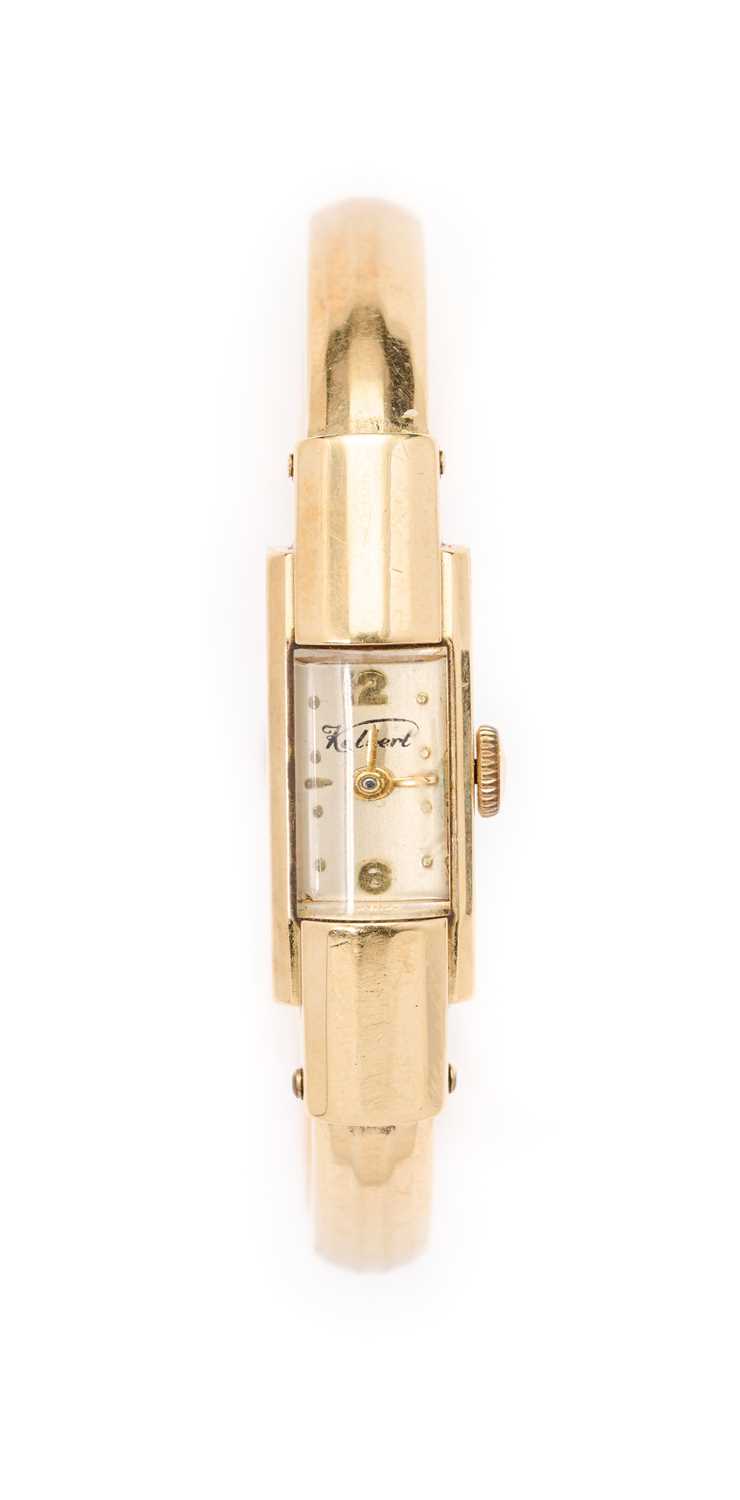 Lot 305 - KELBERT WATCH CO.: A GOLD BANGLE WATCH, SWISS, MID 20TH CENTURY