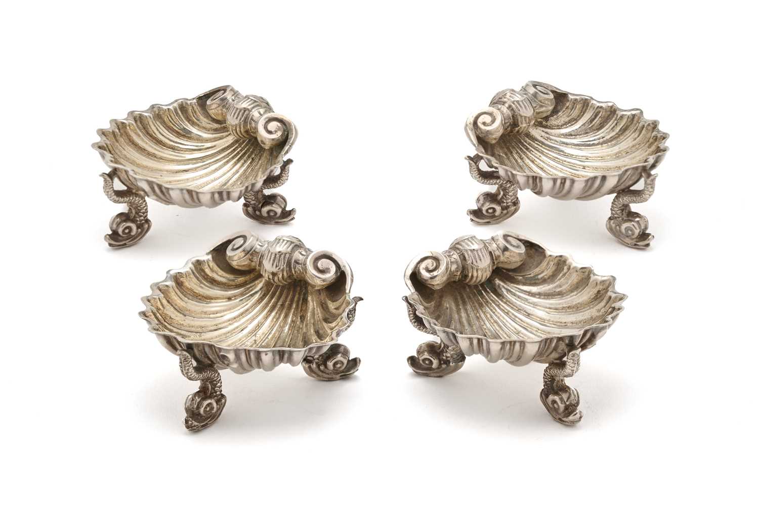 Lot 572 - A SET OF FOUR VICTORIAN SILVER SALT CELLARS, ROBERT HENNELL, LONDON, 1864