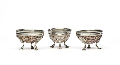 Lot 230 - A SET OF THREE GEORGIAN SILVER-MOUNTED COWRIE SHELL SALT CELLARS, UNMARKED, PERHAPS SCOTTISH, LATE 18TH CENTURY