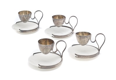 Lot 563 - A SET OF FOUR EDWARDIAN SILVER PATENT EGG CUP STANDS, ALFRED CLARK, LONDON, 1906
