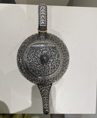 Lot 206 - A KUTCH SILVER TEASET, OOMERSI MAWJI OF BHUJ, WESTERN INDIA, 1880-1890