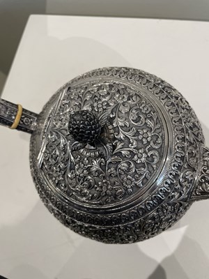 Lot 206 - A KUTCH SILVER TEASET, OOMERSI MAWJI OF BHUJ, WESTERN INDIA, 1880-1890
