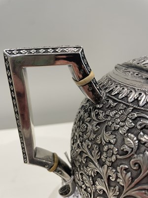 Lot 206 - A KUTCH SILVER TEASET, OOMERSI MAWJI OF BHUJ, WESTERN INDIA, 1880-1890