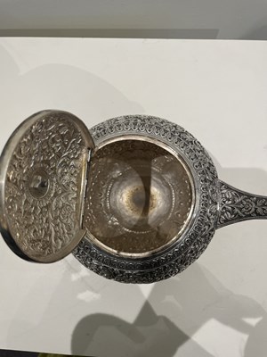 Lot 206 - A KUTCH SILVER TEASET, OOMERSI MAWJI OF BHUJ, WESTERN INDIA, 1880-1890