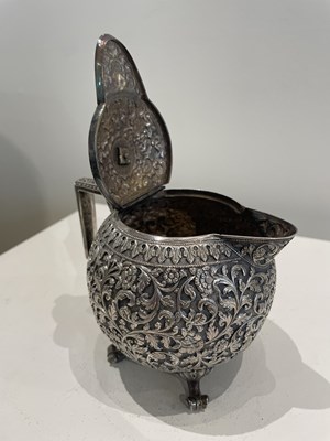 Lot 206 - A KUTCH SILVER TEASET, OOMERSI MAWJI OF BHUJ, WESTERN INDIA, 1880-1890