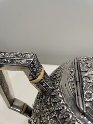 Lot 206 - A KUTCH SILVER TEASET, OOMERSI MAWJI OF BHUJ, WESTERN INDIA, 1880-1890
